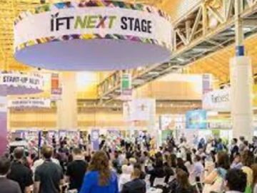 A crowd of people in an indoor event.